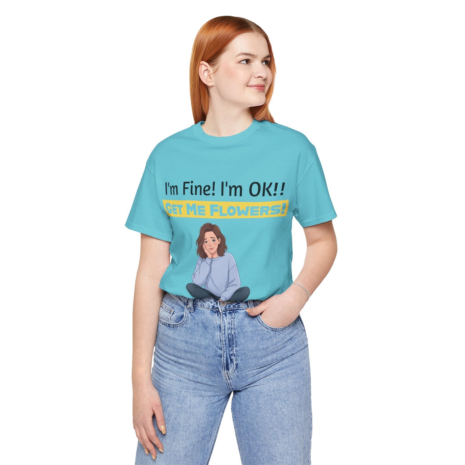 Woman wearing a light blue t-shirt with 'I'm Fine! I'm OK!! GET ME FLOWERS!' text and an illustration of a girl.