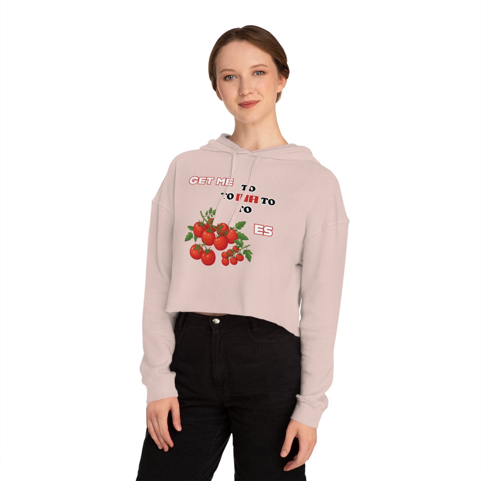 Woman wearing a light pink cropped hoodie featuring a tomato graphic and Get Me to Tomatoes text.