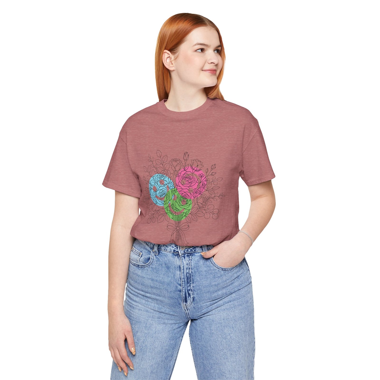Woman wearing a mauve T-shirt featuring a colorful hand-drawn floral bouquet design in teal, magenta, and lime.