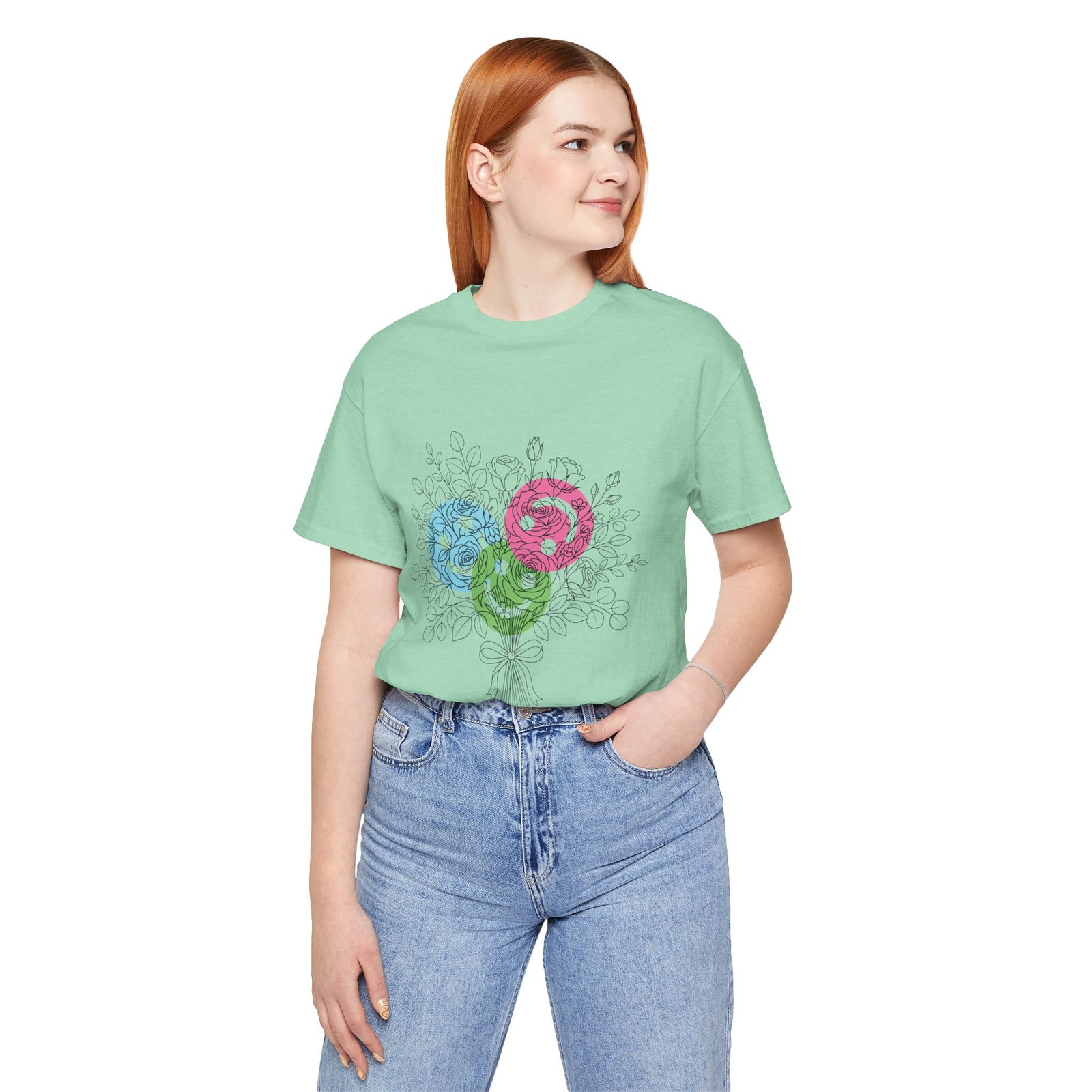 Woman wearing a mint green Floral Yarn Bouquet T-Shirt featuring a hand-drawn sketch of teal, magenta, and lime flowers.