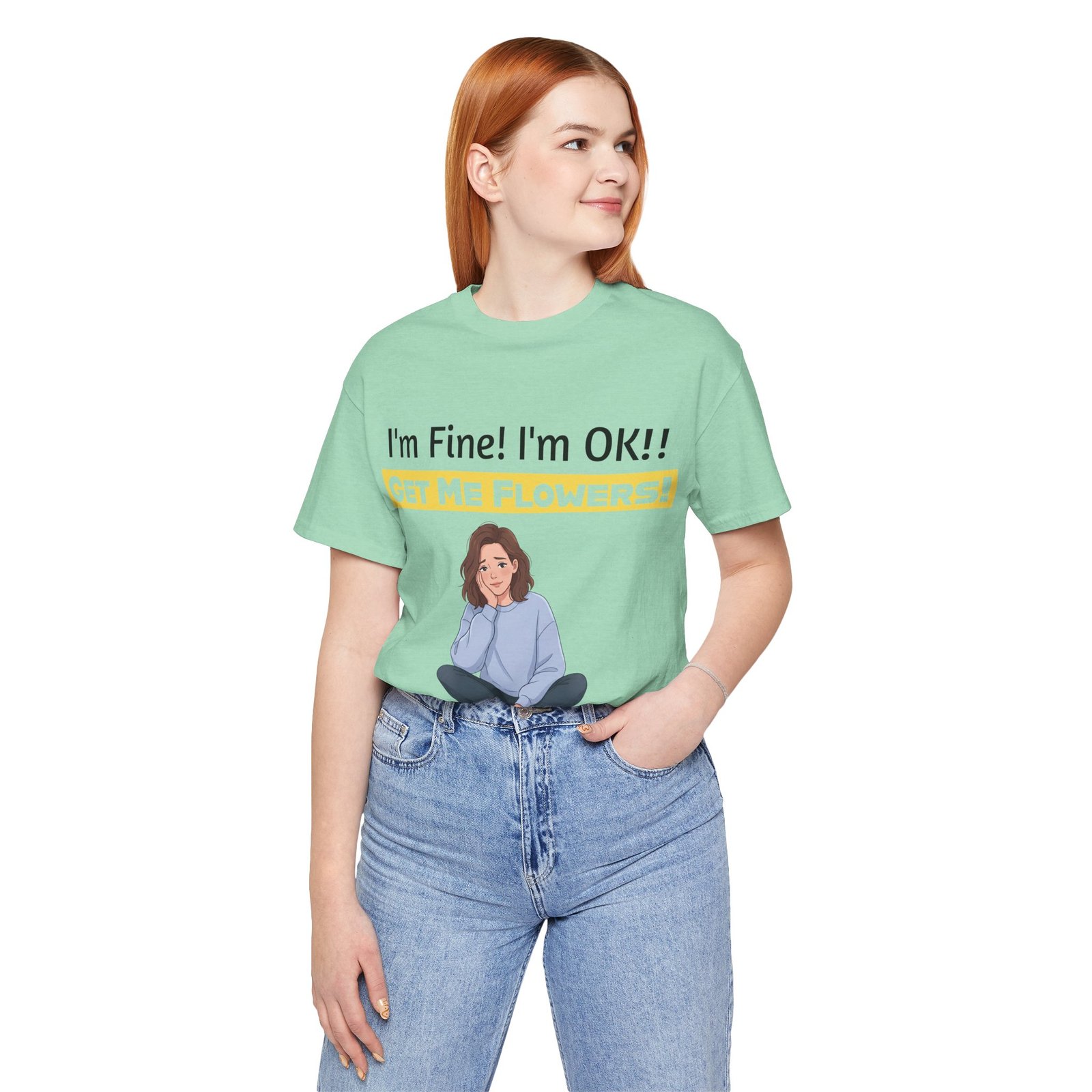 Woman wearing a mint green I'm Fine! I'm OK!! Get Me Flowers! funny t-shirt with a cartoon illustration.