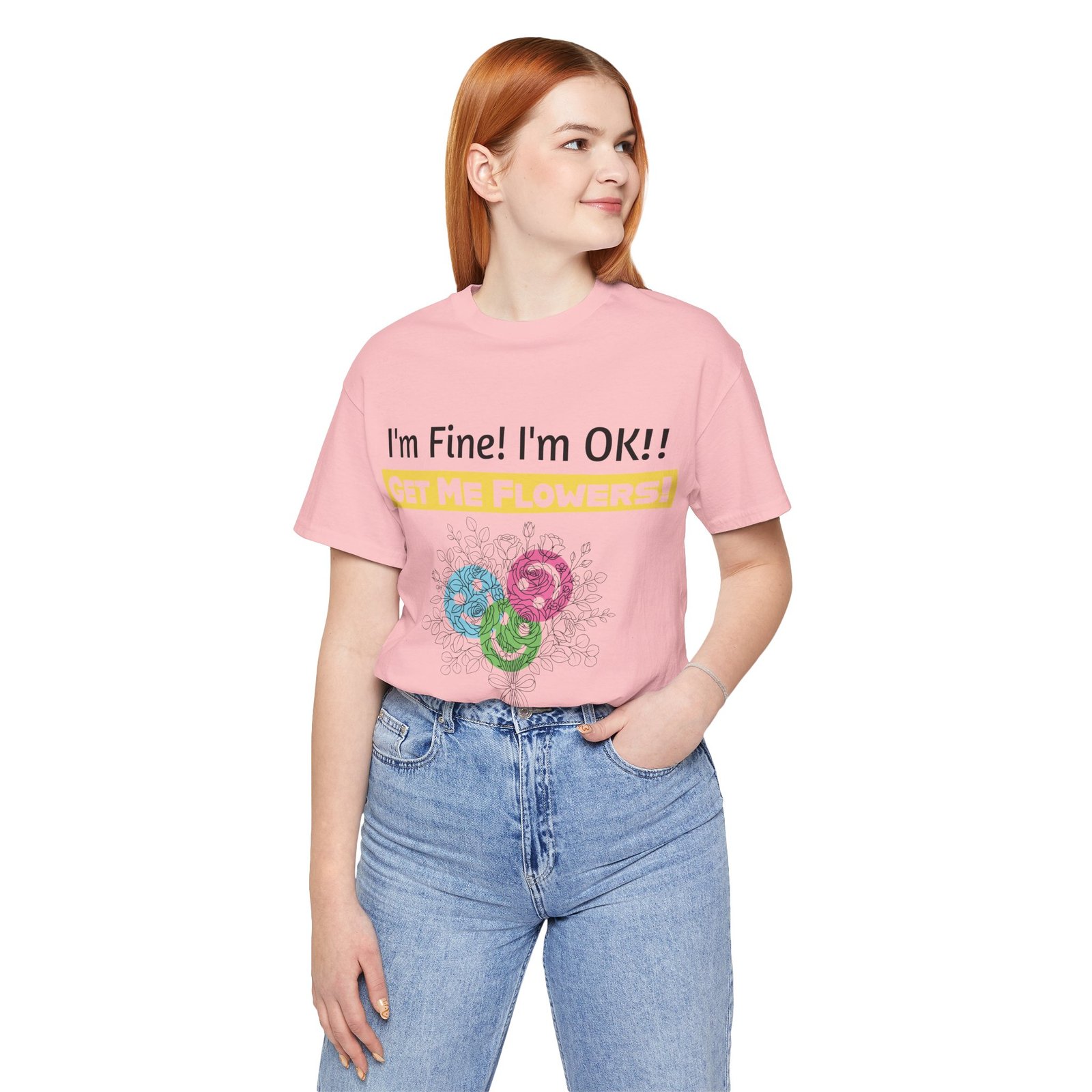 Woman wearing a pink Bella+Canvas t-shirt with 'I'm Fine! I'm OK!! GET ME FLOWERS!' text and colorful abstract flowers.