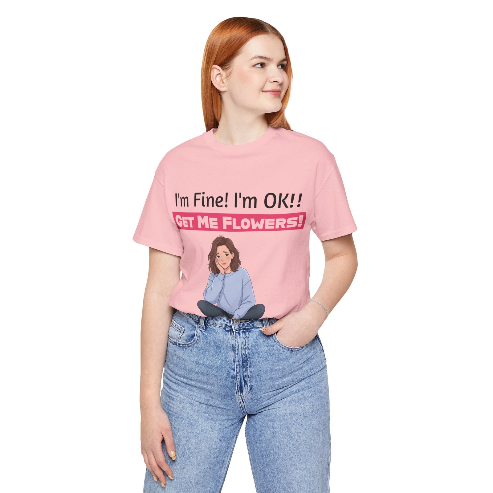 Woman wearing a pink funny t-shirt with 'I'm Fine! I'm OK!! GET ME FLOWERS!' graphic and an illustration.