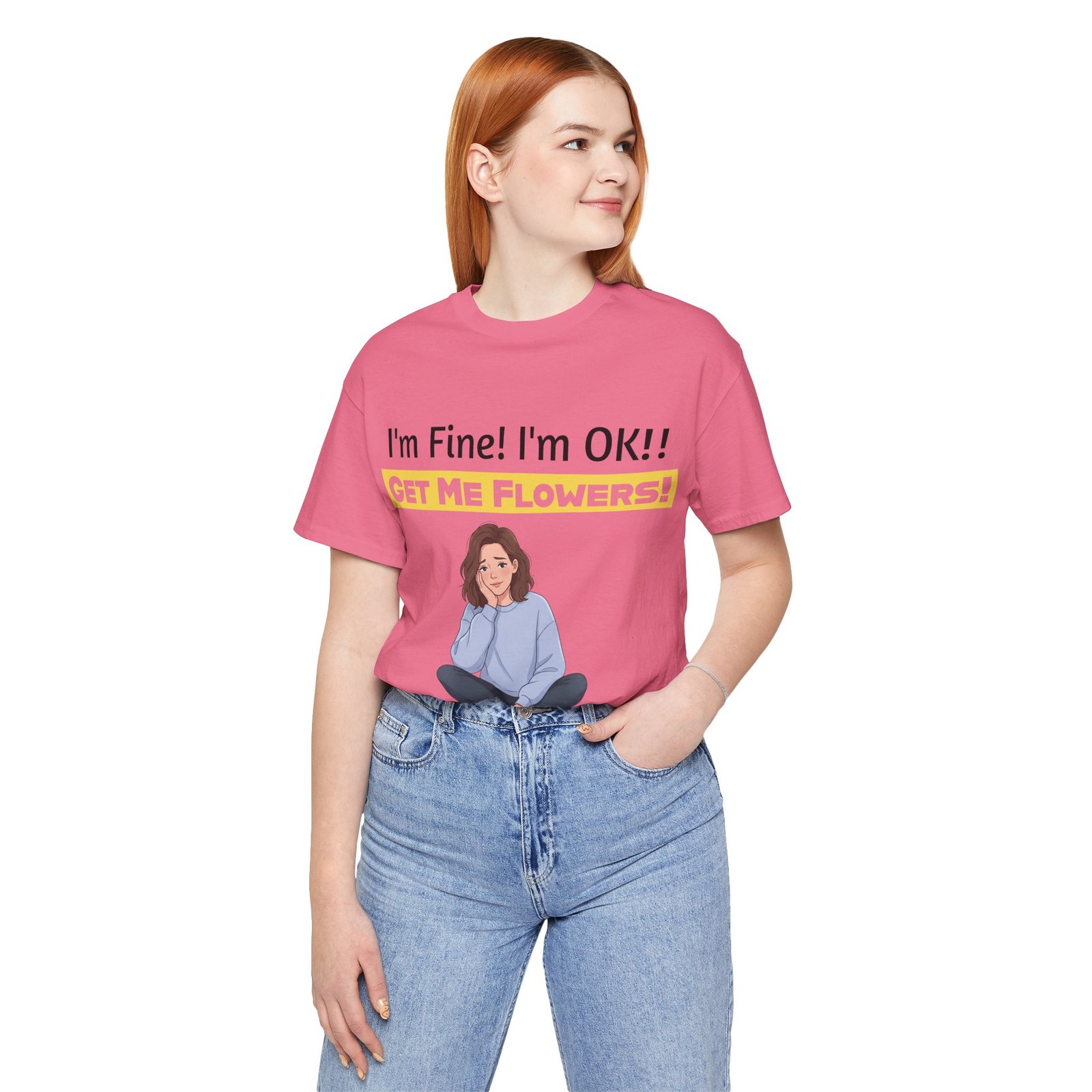 Woman wearing a pink T-shirt with an illustration of a girl and the text "I'm Fine! I'm OK!! GET ME FLOWERS!"