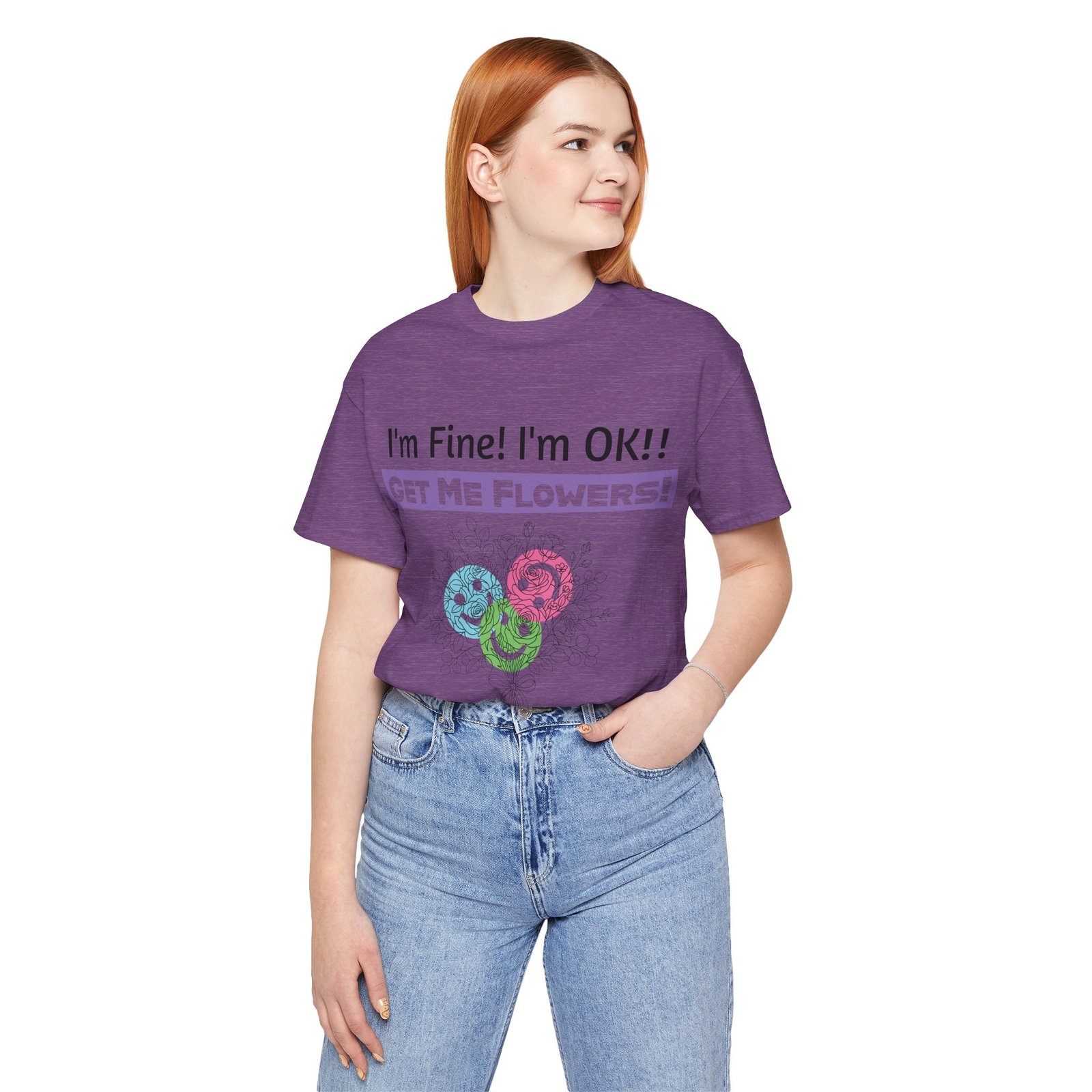 Woman wearing a purple graphic t-shirt with "I'm Fine! I'm OK!! GET ME FLOWERS!" and colorful abstract flower print.