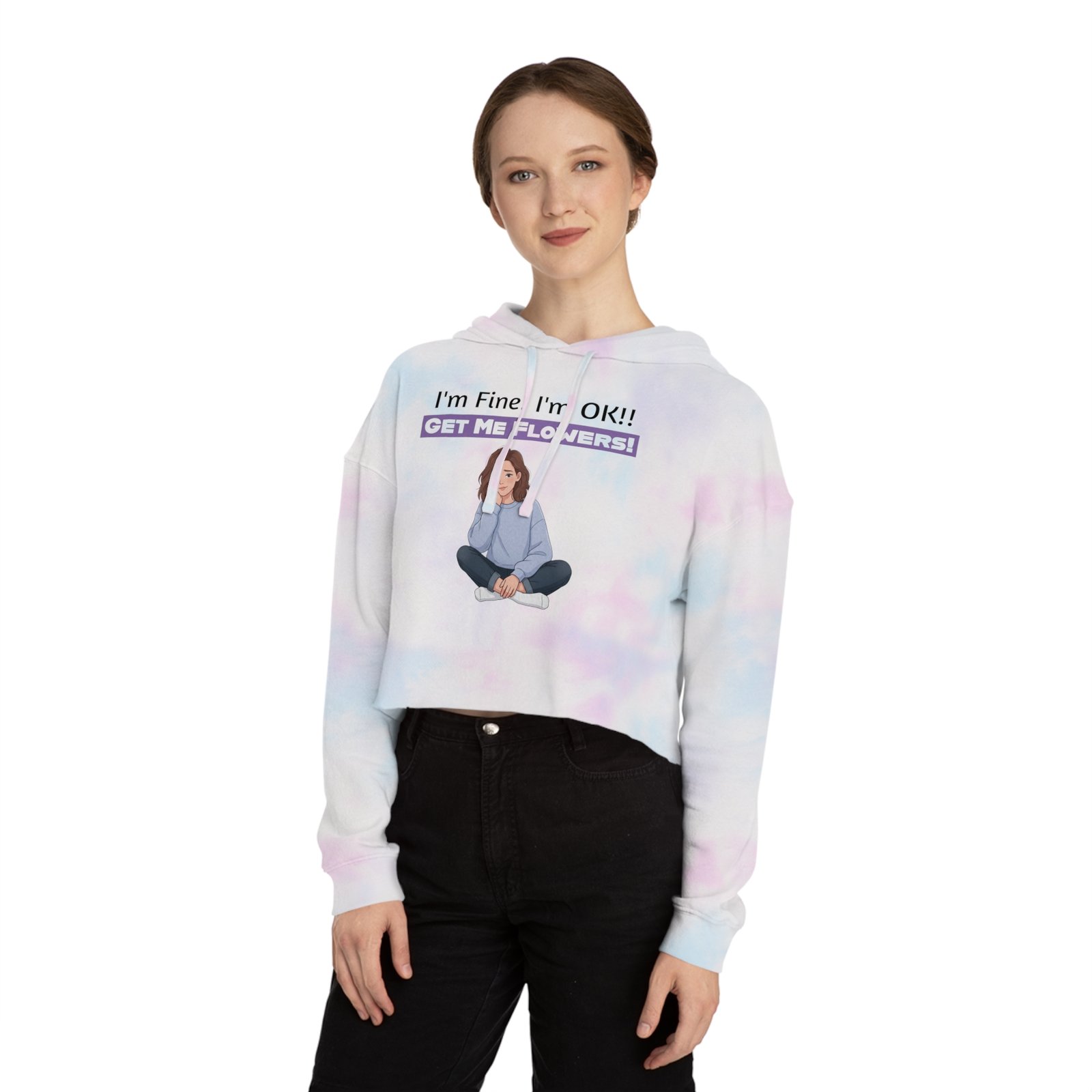 Woman wearing a white and purple tie-dye cropped hoodie with "I'm Fine I'm OK!! GET ME FLOWERS!" graphic.
