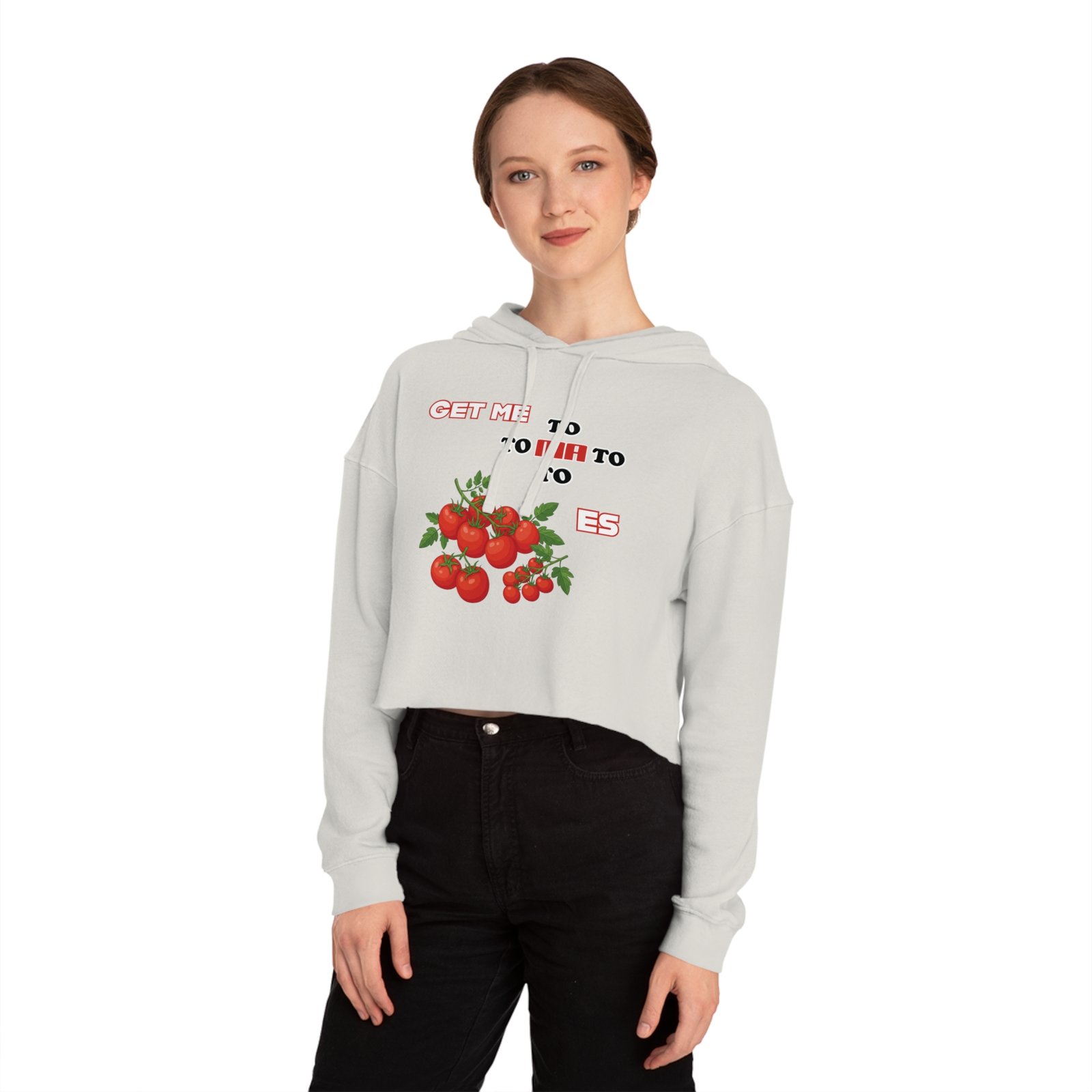 Woman wearing a white cropped hoodie featuring a tomato graphic and Get Me to Tomatoes text.