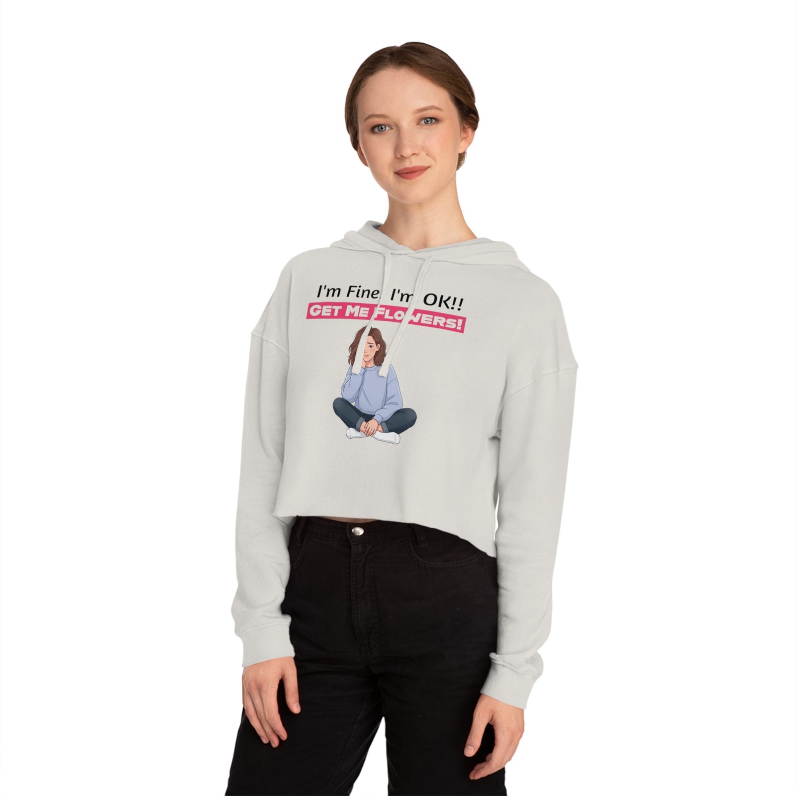 Woman wearing a white cropped hoodie with a funny graphic and text "I'm Fine! I'm OK!! GET ME FLOWERS!"